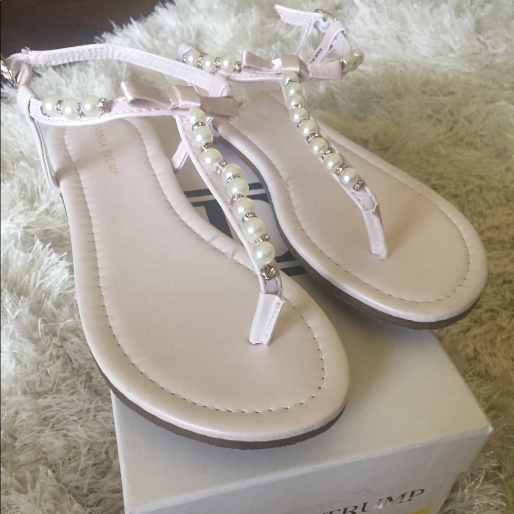 Ivanka Trump pearl and rhinestone thong sandals.